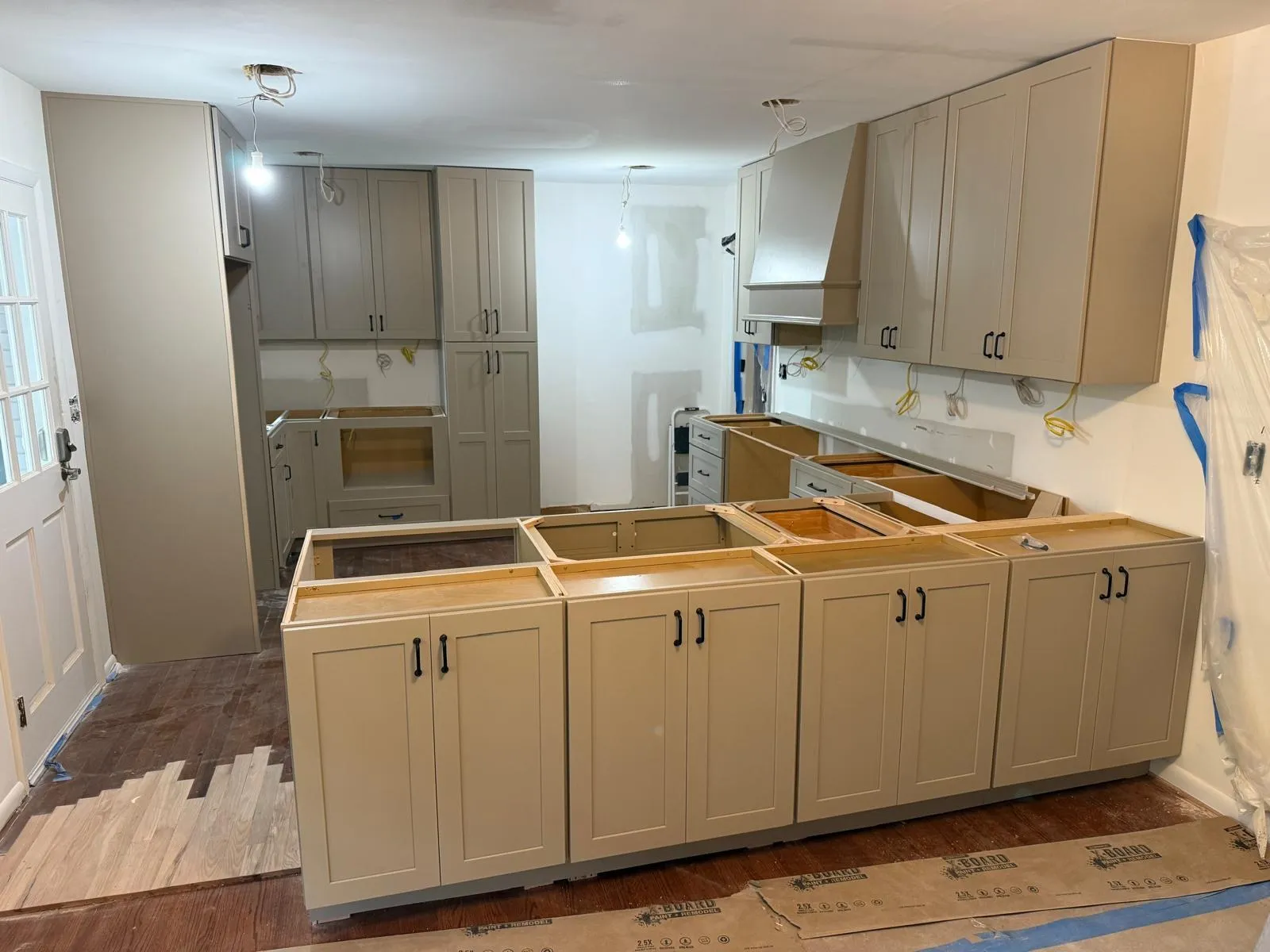 Center Cabinet crew setting cabinets during installation