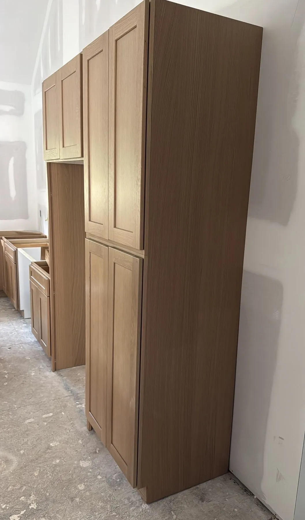Oak tall units going in